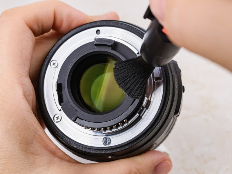 Cleaning a Lens with a Brush