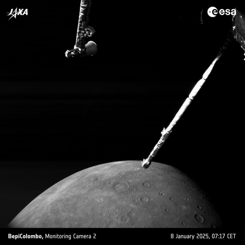 Black and white image of part of the BepiColombo spacecraft in space, with a view of Mercury's surface below. The ESA and JAXA logos are visible. Date and time: 8 January 2025, 07:17 CET.