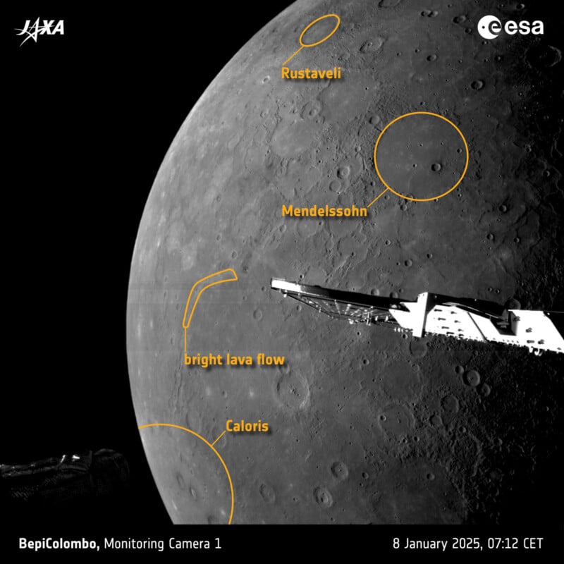 A black and white image of Mercury's surface captured by the BepiColombo spacecraft. Notable features include craters labeled Rustaveli, Mendelssohn, and Caloris, a bright lava flow, and the spacecraft's structure.