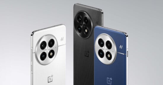 Three smartphones are displayed, showcasing their backs. The phones feature a circular triple-camera module with a textured finish. The colors from left to right are white, black, and blue. Each phone has a shiny metallic edge and a logo below the cameras.