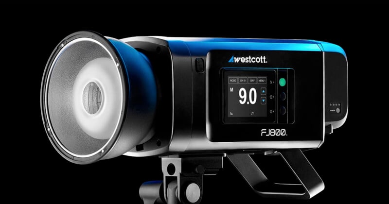 A studio strobe light labeled "Westcott FJ800" against a black background. The digital display shows a power setting of 9.0. The device has a sleek design with a mounting bracket.